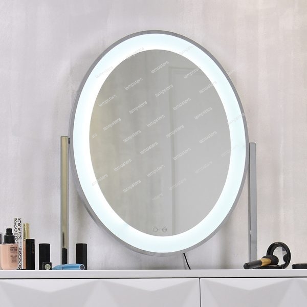 big mirror with lights around i