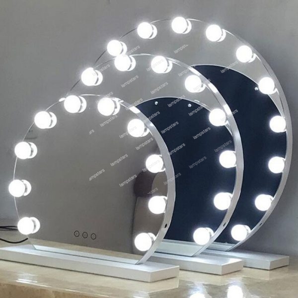 white vanity with mirror and lights